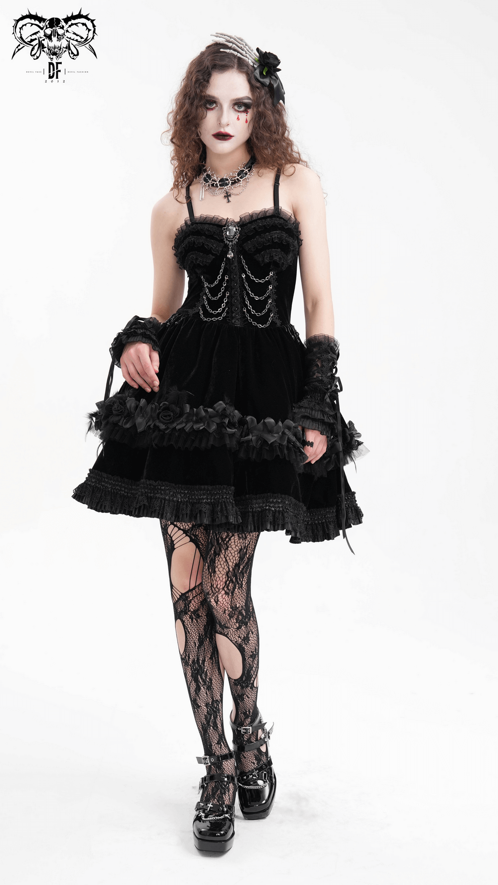 Elegant gothic black dress with lace and chain details, featuring floral accents, perfect for a chic evening look.