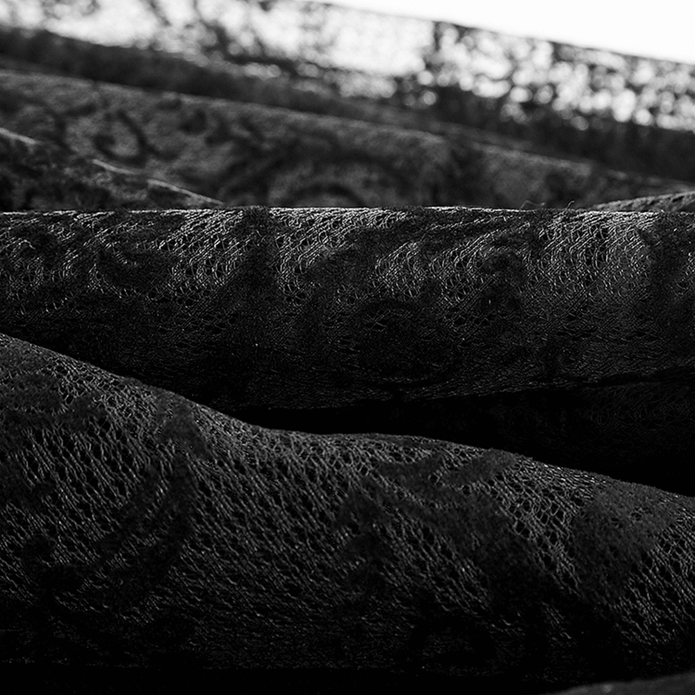 Close-up of luxurious black lace fabric featuring a floral pattern, ideal for gothic fashion and elegant cloaks.