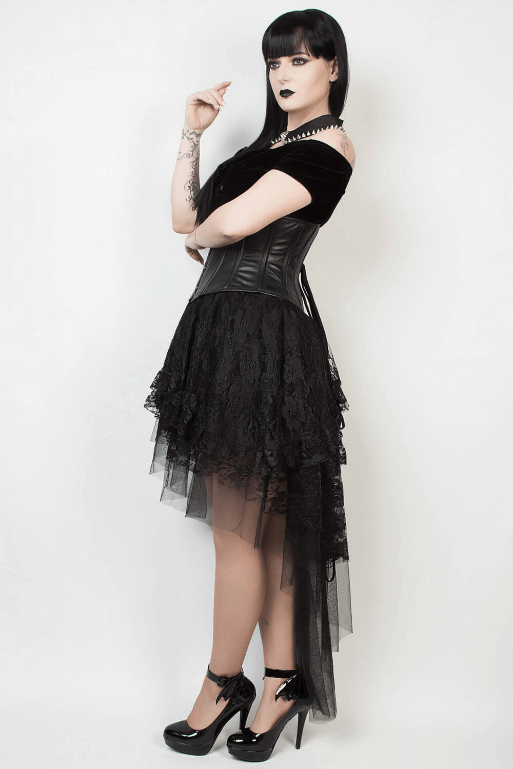 Elegant black lace layered gothic skirt showcased on model, perfect for gothic fashion lovers.