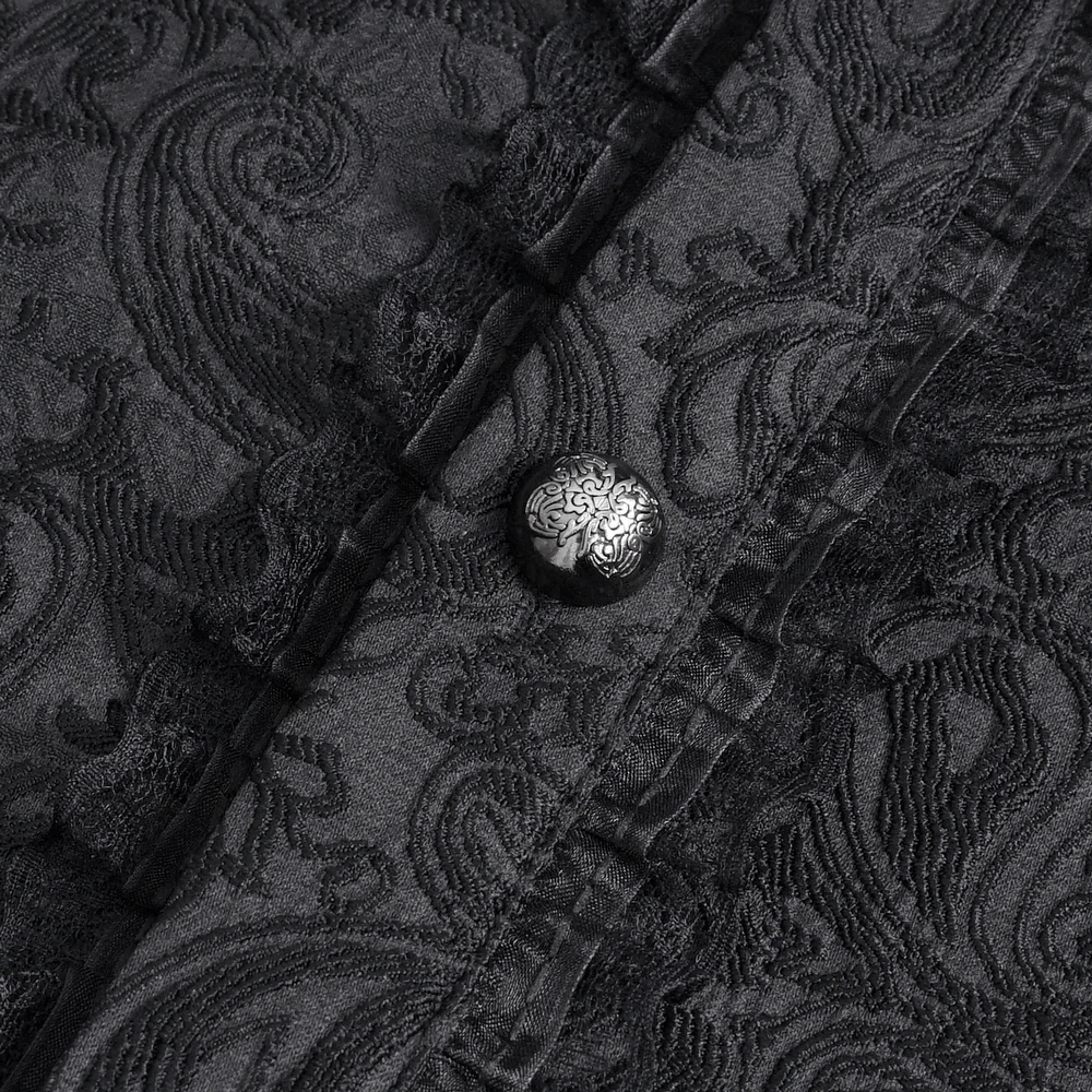 Close-up of elegant black lace shirt button with intricate detailing, showcasing a gothic style.