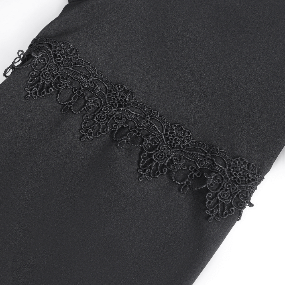 Close-up of elegant black lace detailing on a long sleeve gothic shirt for men.