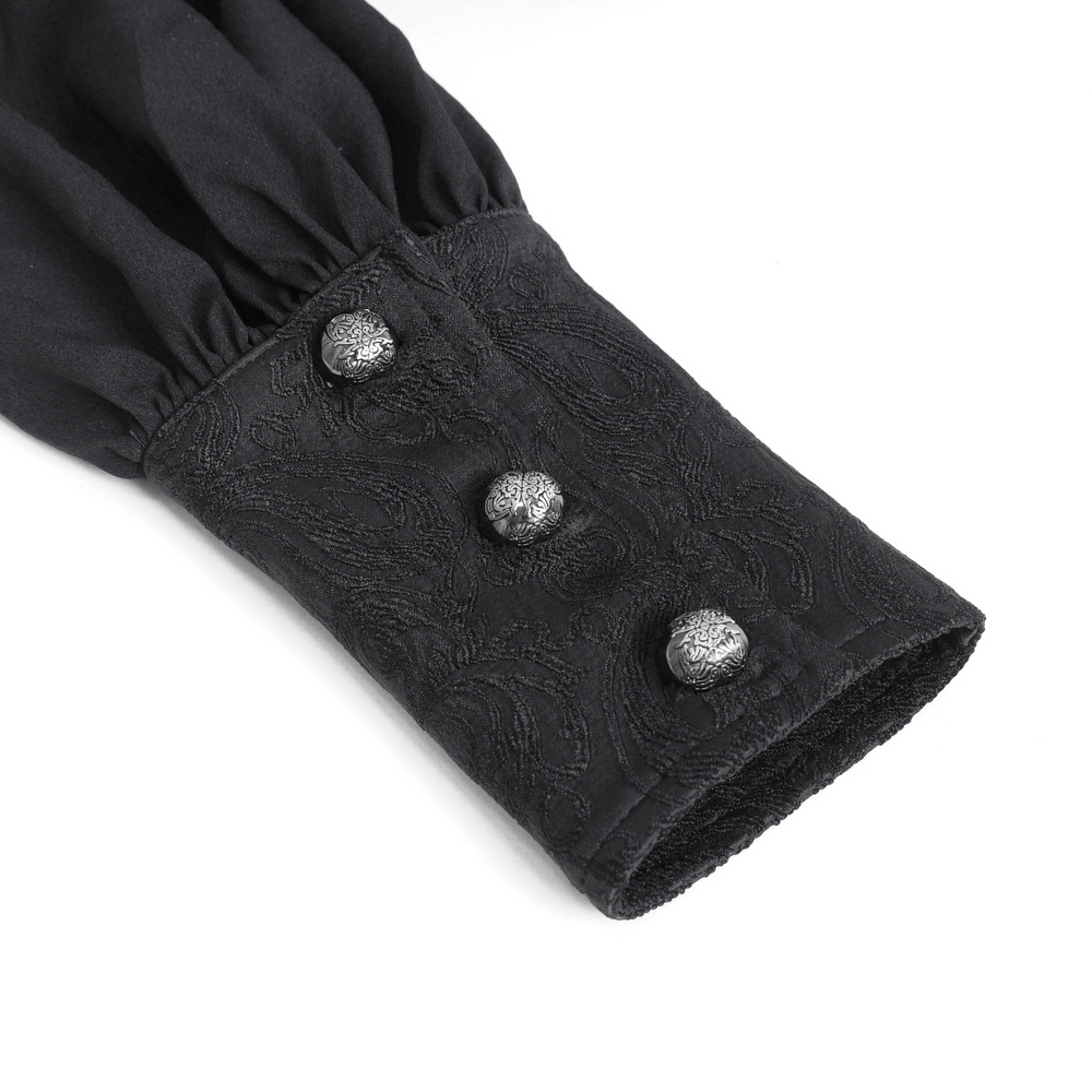 Close-up of an elegant black lace-cuffed sleeve with decorative buttons, showcasing gothic shirt details.