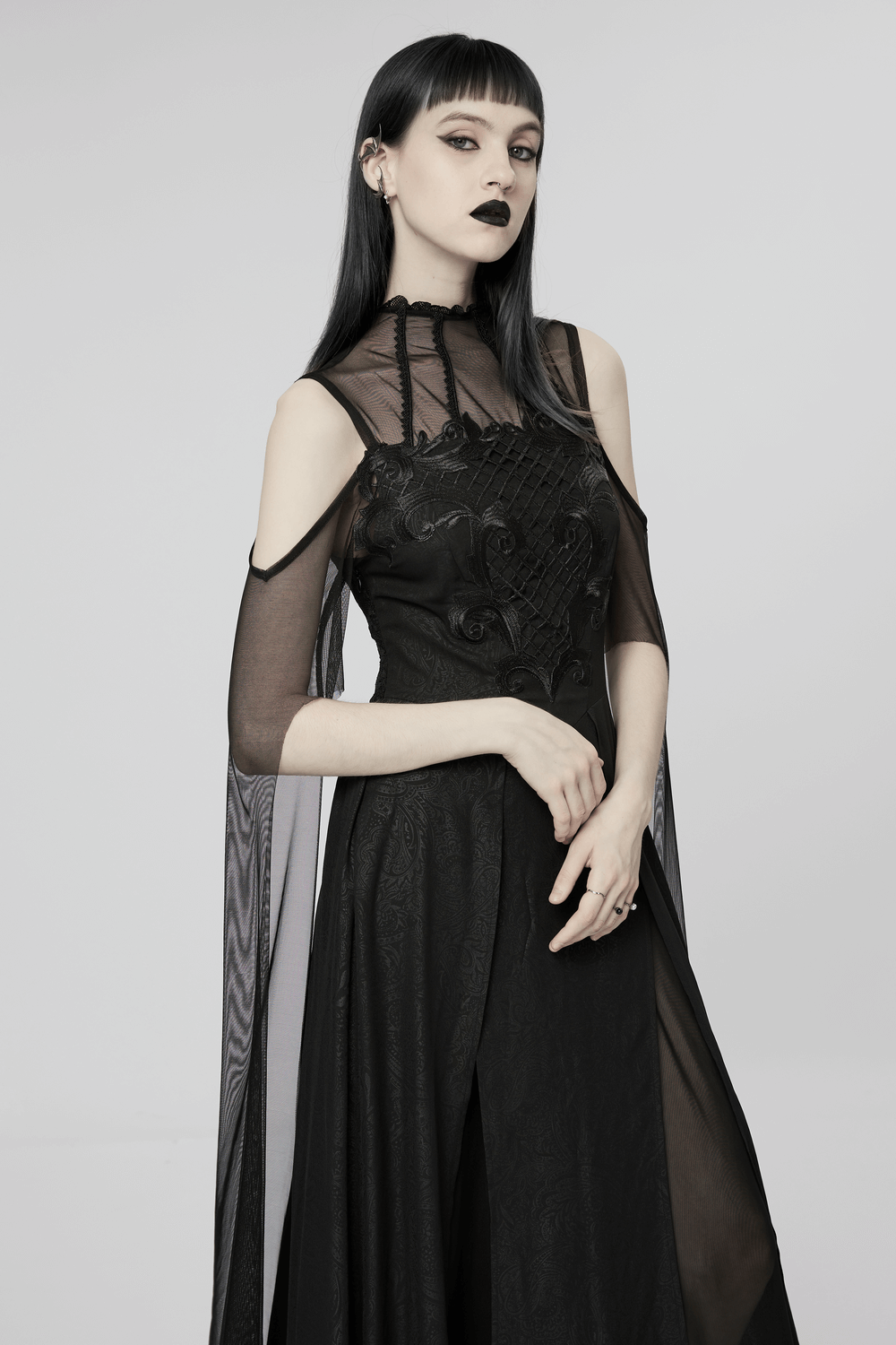 Elegant black lace off-the-shoulder dress with cape sleeves for a gothic, sophisticated look.