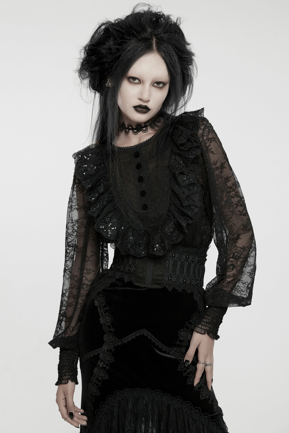 Elegant black lace blouse with ruffles and sequins, perfect for a gothic wardrobe.
