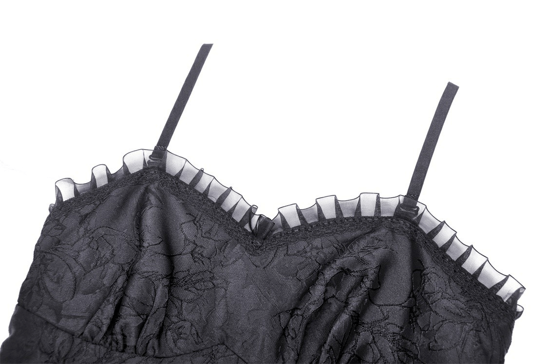 Elegant black lace dress detail with intricate tiered hem and delicate straps for evening events.