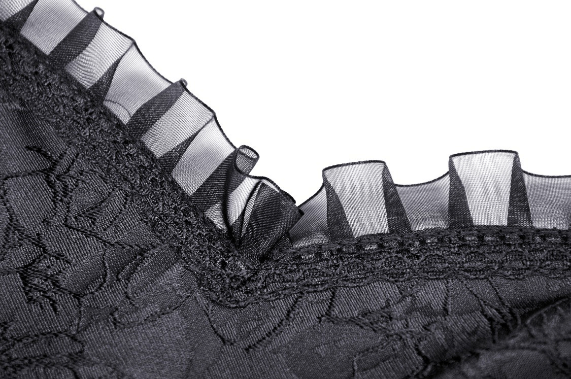 Close-up of elegant black lace with tiered ruffles, showcasing intricate detailing for a stylish evening dress.