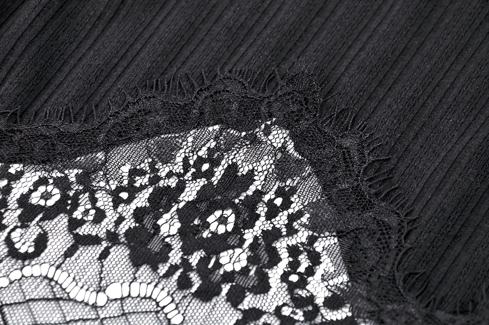 Close-up of black ribbed fabric with elegant lace trim, showcasing gothic and edgy style in fashion.