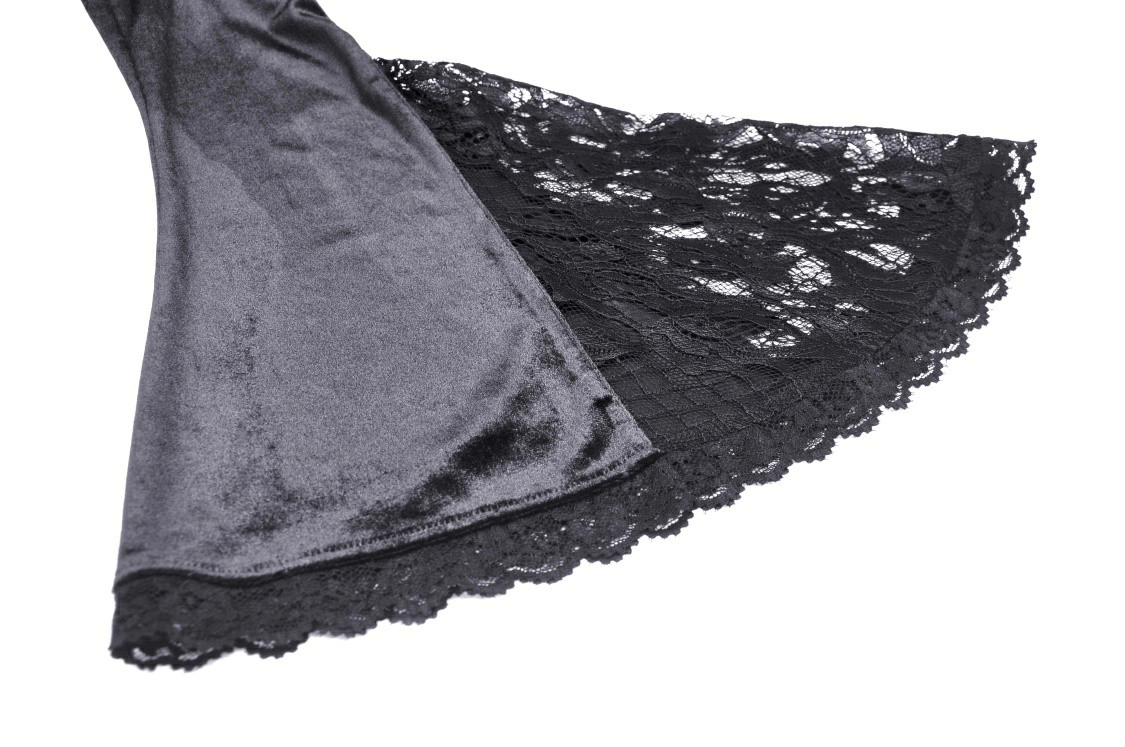 Elegant black lace detail on a full-length Victorian gown, showcasing intricate embroidery and flared sleeve style.