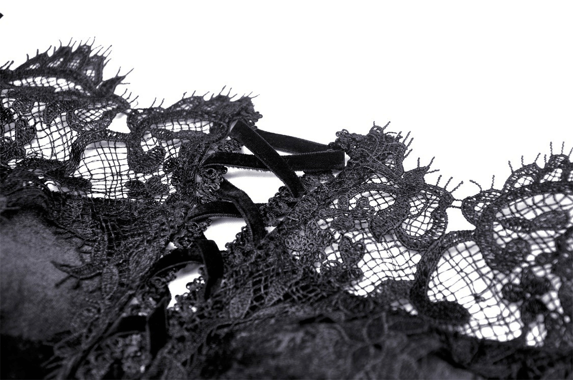 Close-up of intricate black lace detailing on a Victorian gown, showcasing gothic elegance and vintage style.