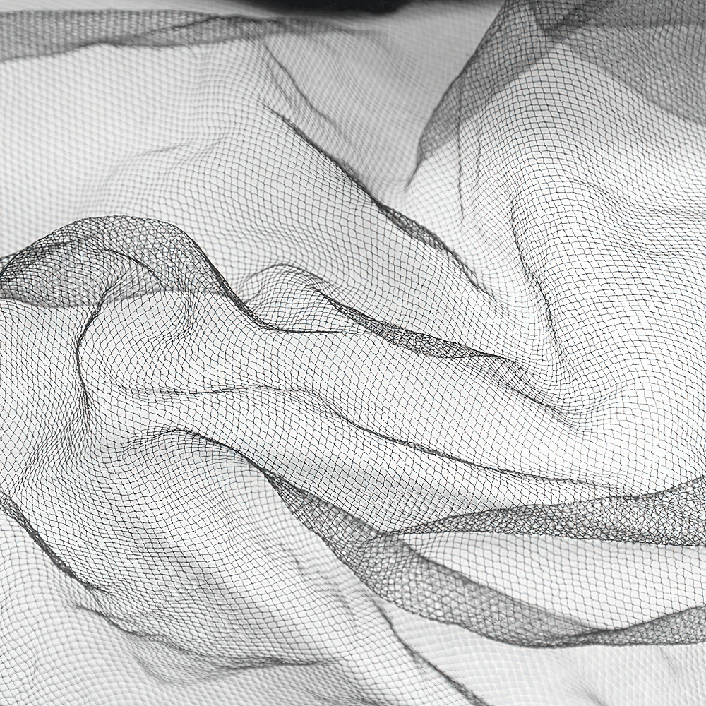 Soft black lace fabric draping elegantly, perfect for creating stunning wedding veils.