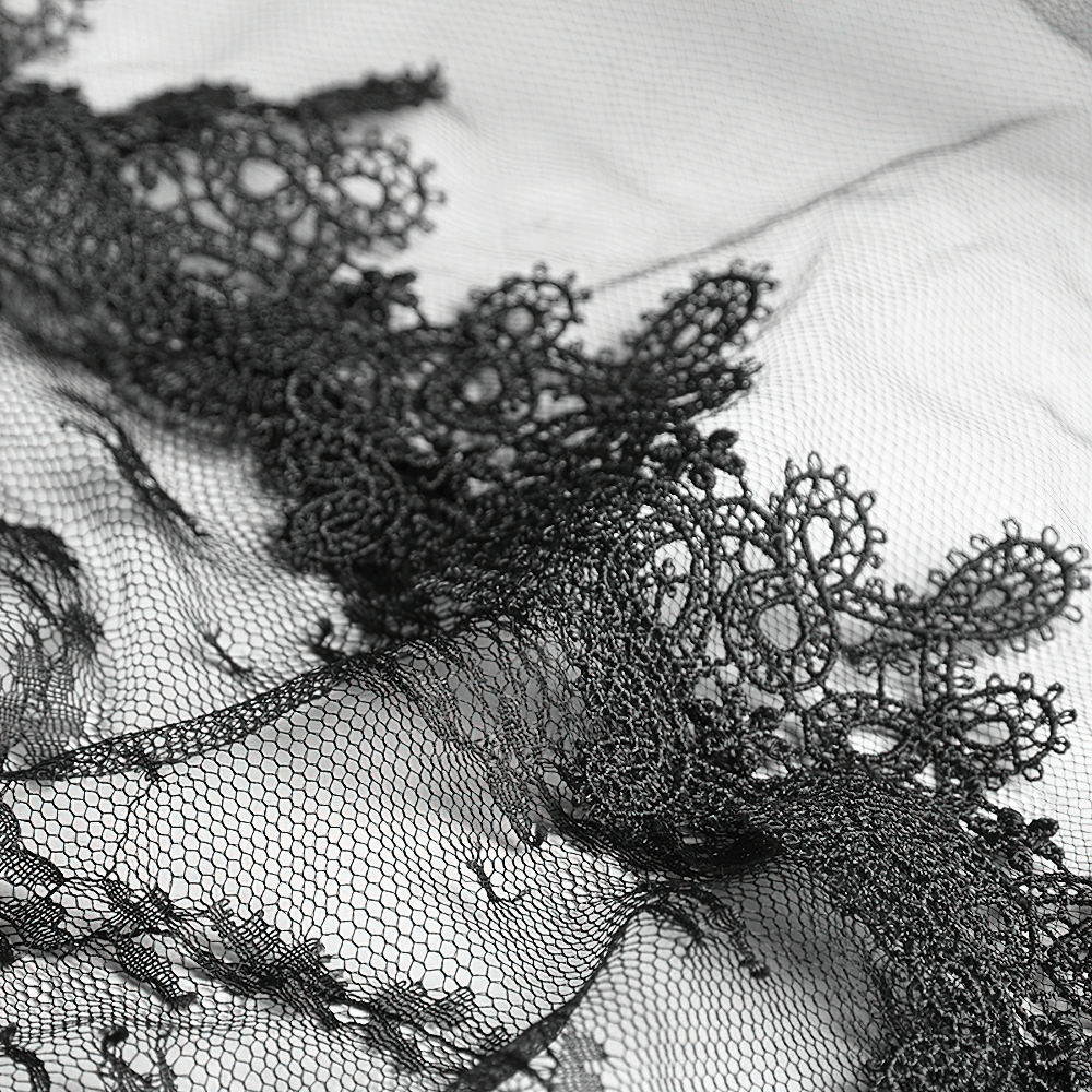 Close-up of elegant black lace with intricate floral patterns, perfect for gothic wedding veils and dramatic bridal styles.