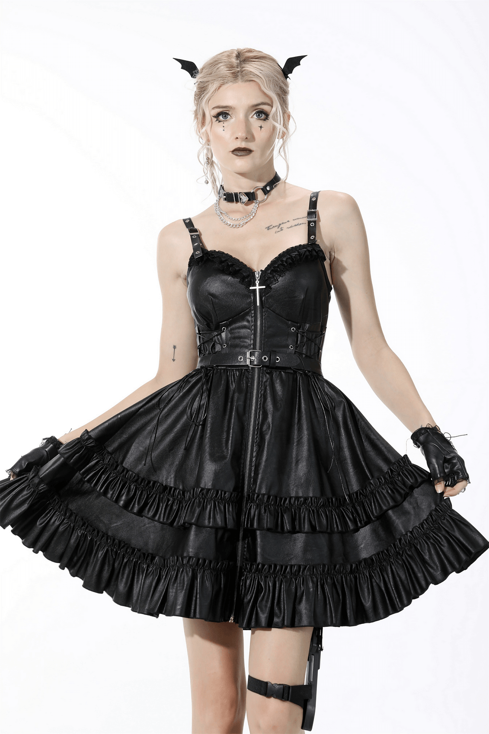 Elegant black leather dress with ruffled layers and adjustable straps, perfect for bold evening events.
