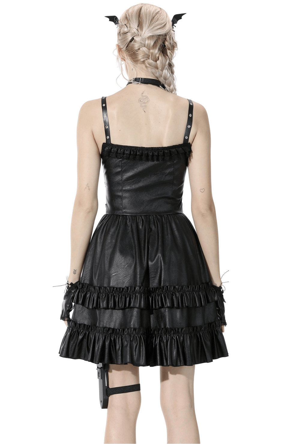 Back view of an elegant black leather dress with ruffled layers and adjustable straps, perfect for bold evening style.