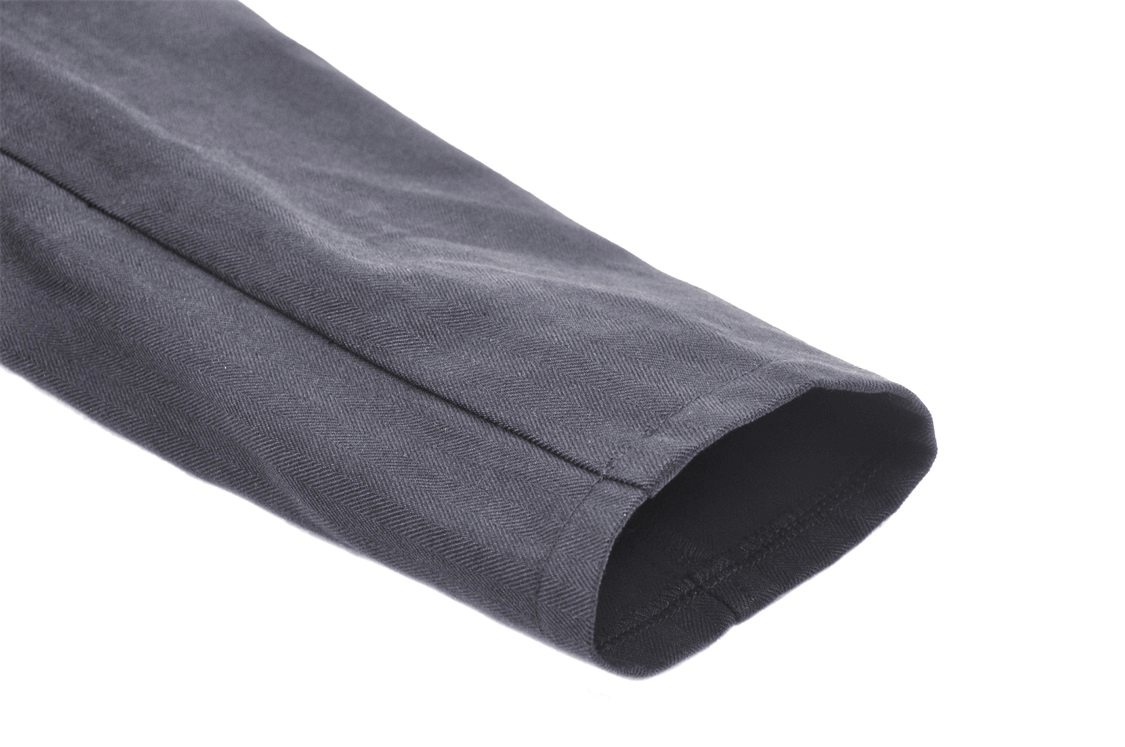 Close-up of the sleek sleeve of an elegant black long coat showcasing its tailored design and premium material.