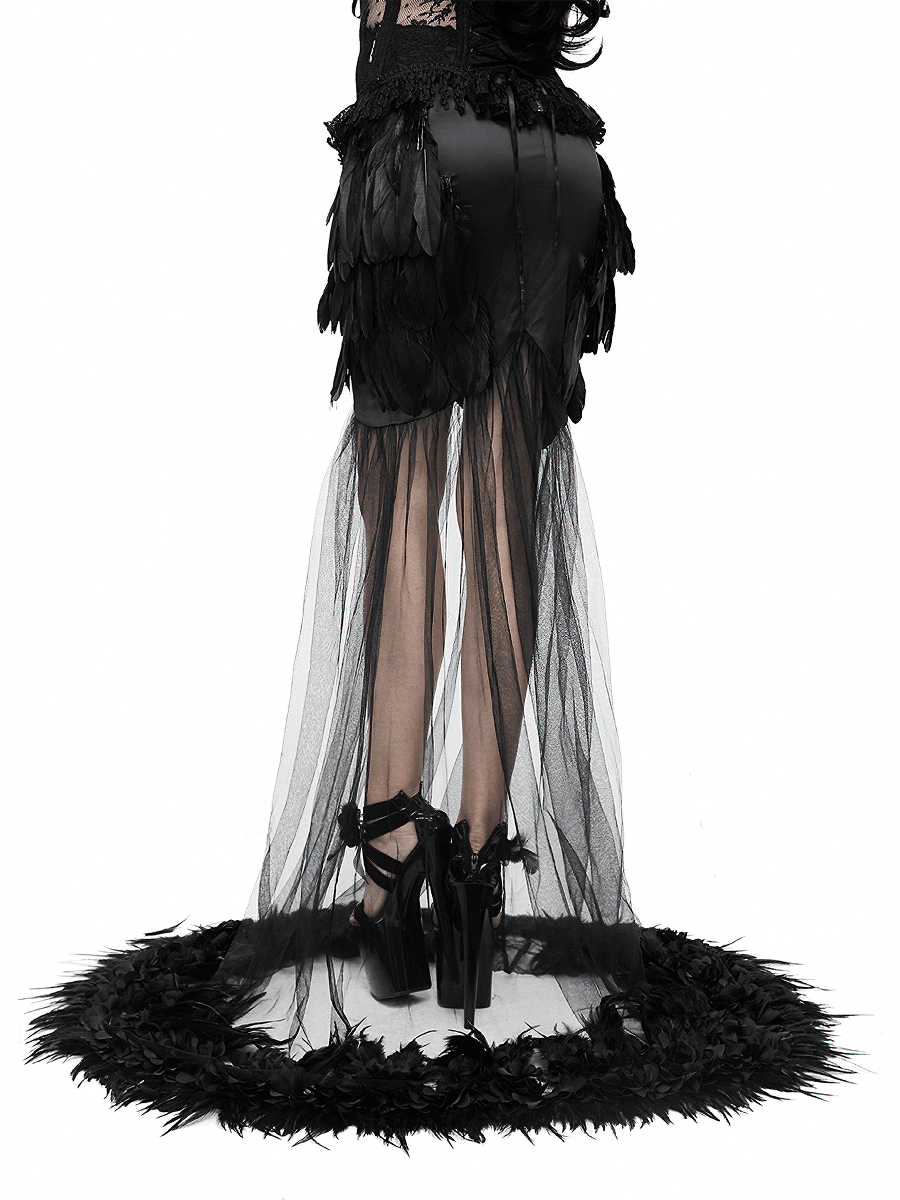 Elegant black long skirt with flared mesh and feather details, showcasing a gothic style and graceful silhouette.