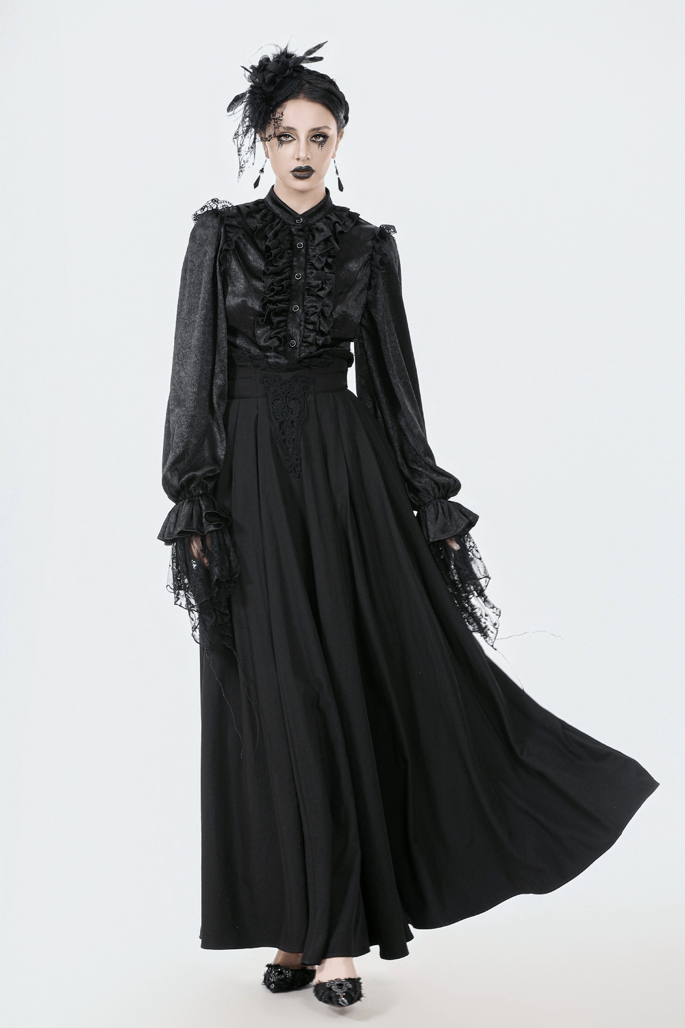 Elegant Black Maxi Skirt with Lace Back and Bow Detail worn in a stylish black outfit.