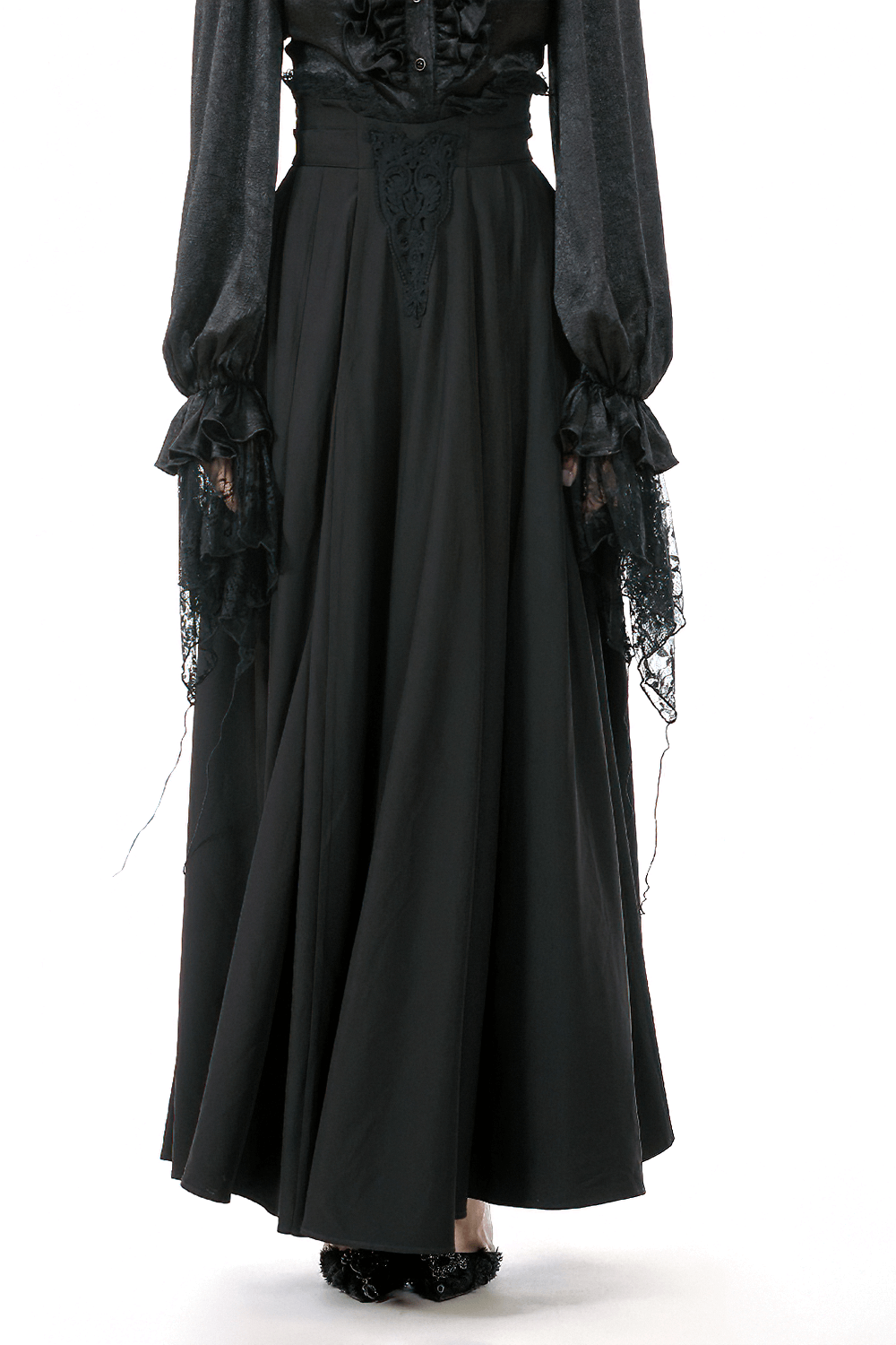 Elegant Black Maxi Skirt with Lace Back and Bow Detail worn with a stylish blouse.