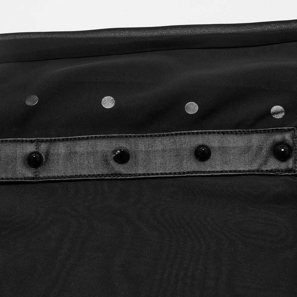 Close-up of black sheer chiffon fabric with decorative buttons and polka dots for goth maxi skirt design.