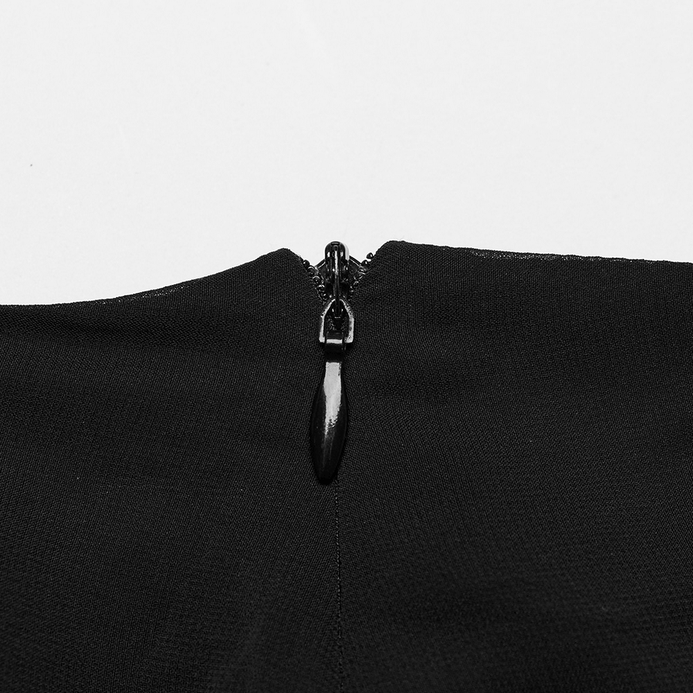 Close-up of the zipper detail on an elegant black sheer chiffon maxi skirt.