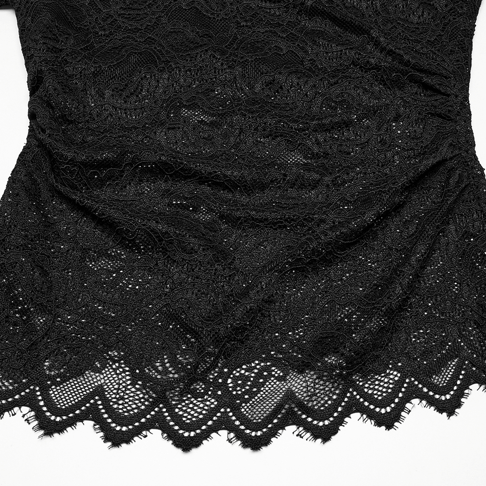 Elegant black sheer lace fabric with intricate floral patterns and scalloped hem, perfect for gothic-inspired fashion.