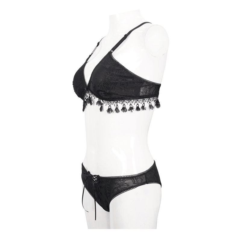 Elegant black swimsuit with fringe and lace, perfect for a gothic beach look.
