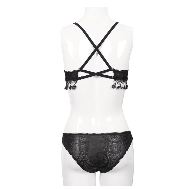 Elegant black bikini with fringe detailing and crisscross straps, showcasing a modern gothic style.