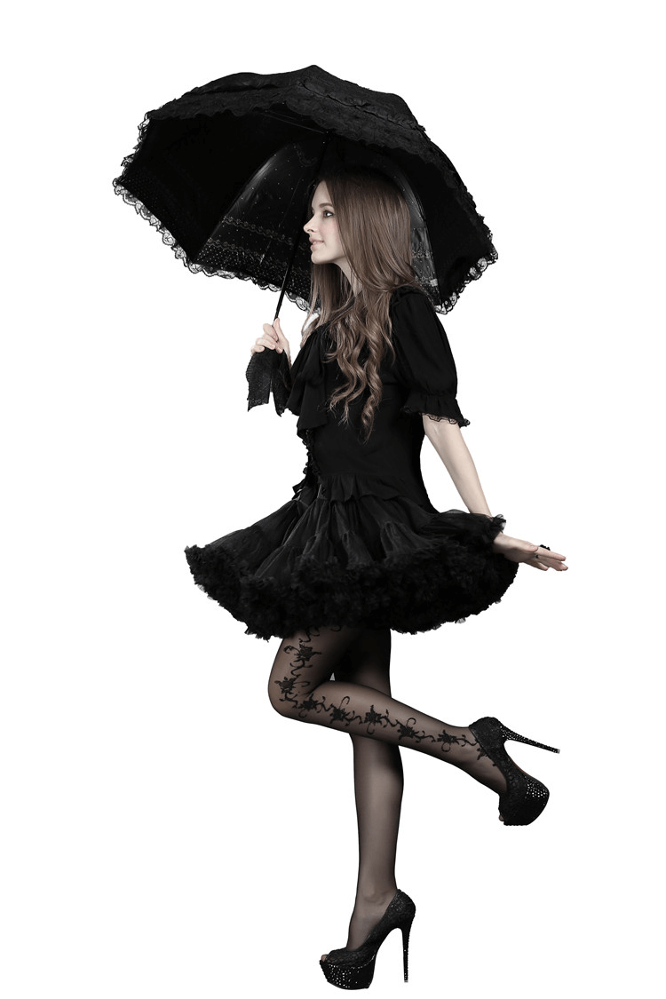 Model in a chic black layered tulle skirt, holding a black lace parasol, showcasing elegance and whimsy.