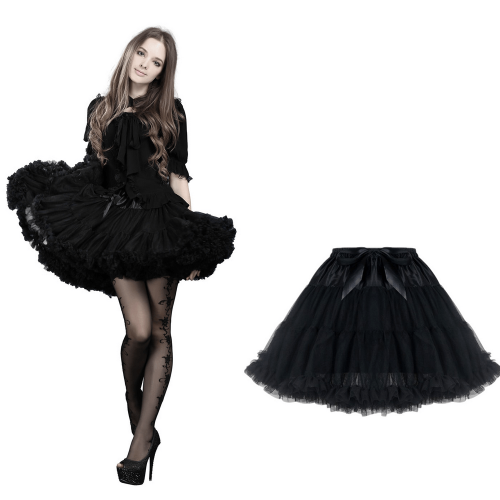 Chic black tulle skirt with satin waistband, featuring a voluminous silhouette and a playful black bow for evening elegance.
