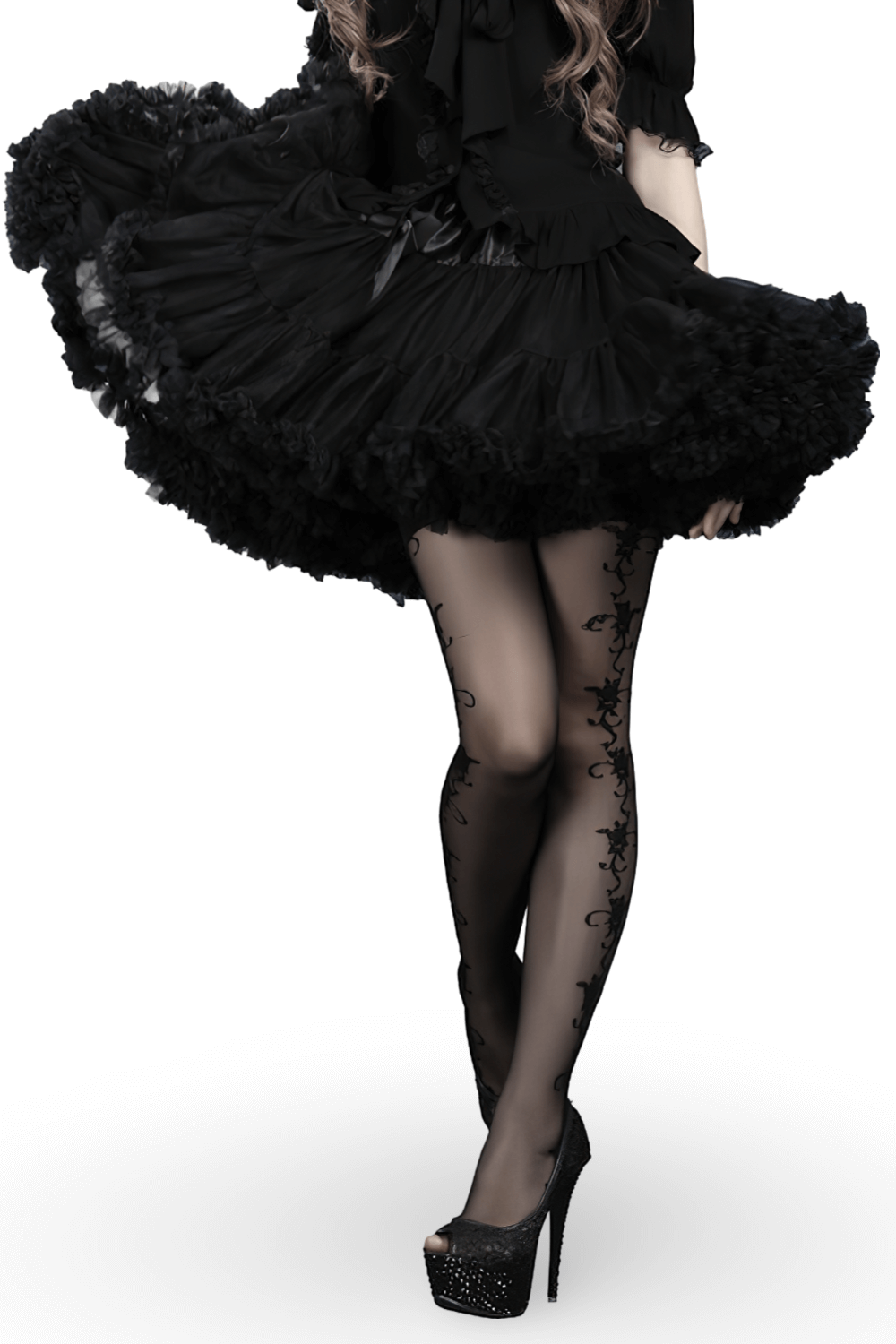 Chic black tulle skirt with satin waistband, showcasing elegant layered design and stylish black tights.