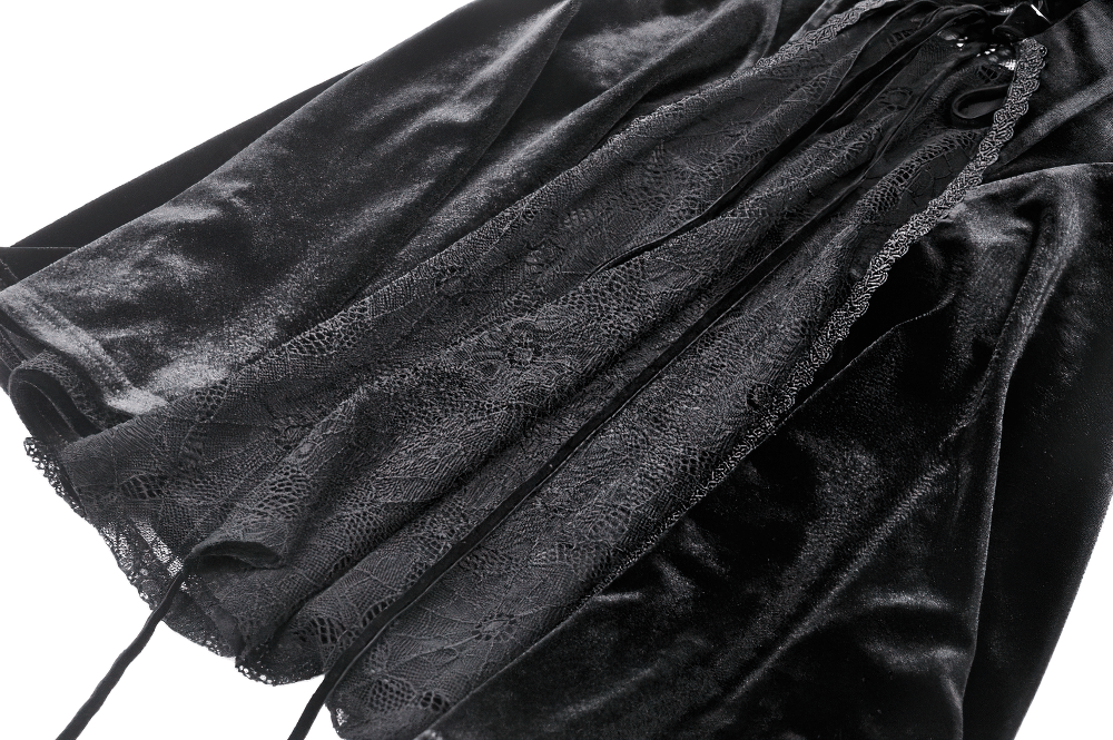 Elegant black velvet gothic dress with lace-up detail and bell sleeves, perfect for dark fashion enthusiasts.