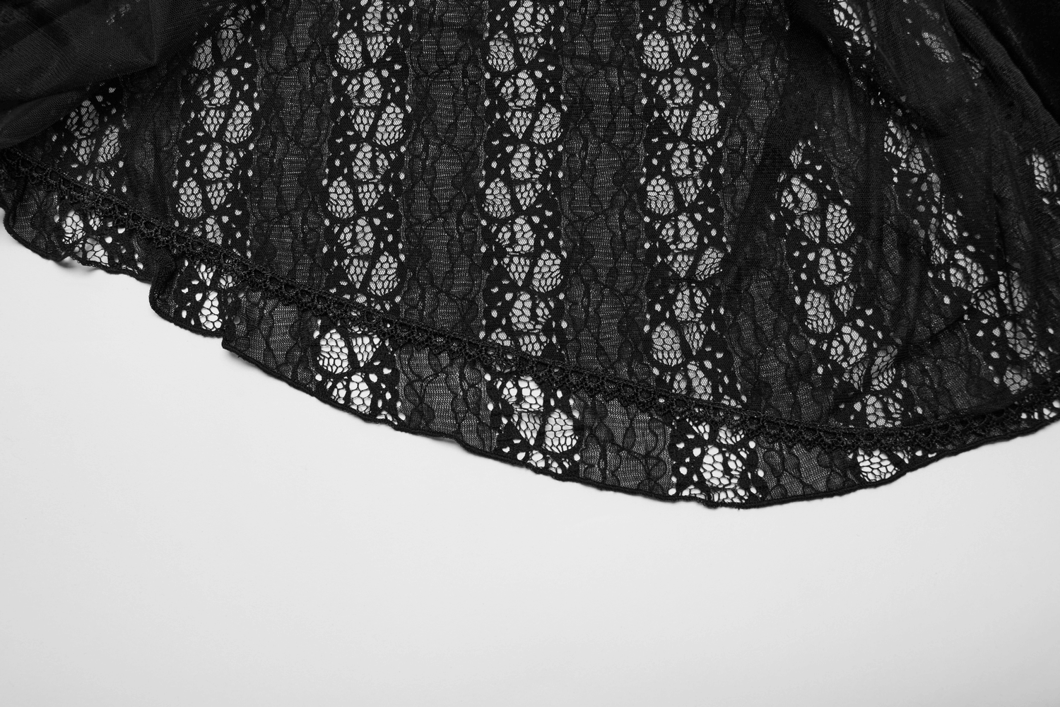 Elegant black lace fabric showcasing intricate patterns, perfect for gothic or chic clothing designs.