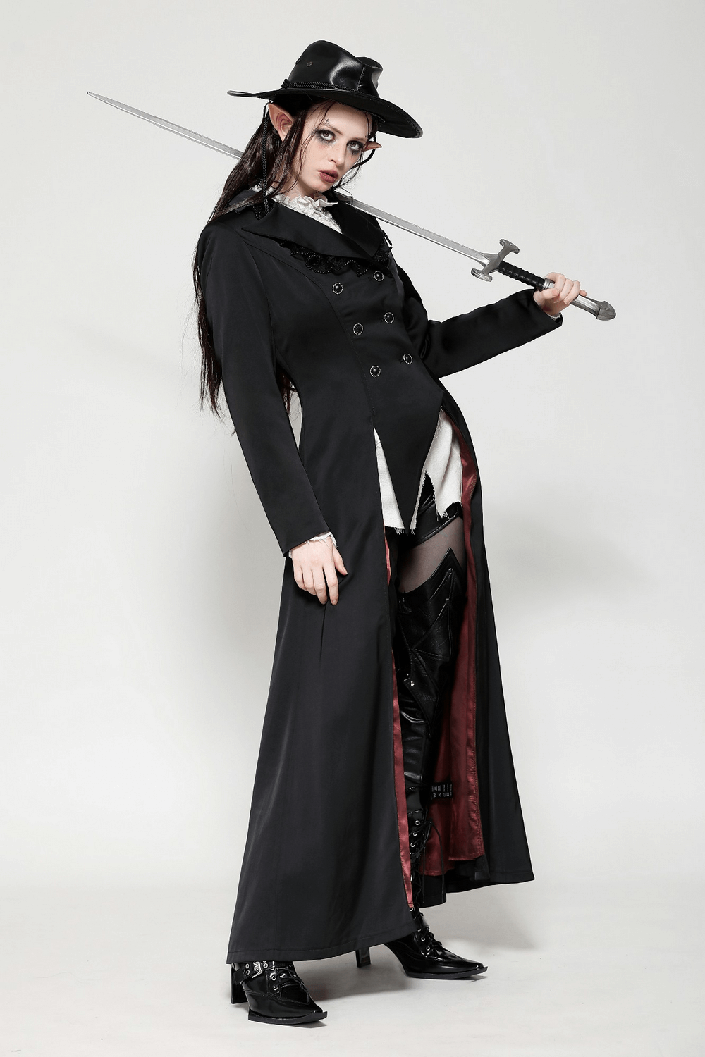 Elegant black Victorian-inspired coat with satin details, double-breasted design, and sword accessory for a dramatic steampunk look.