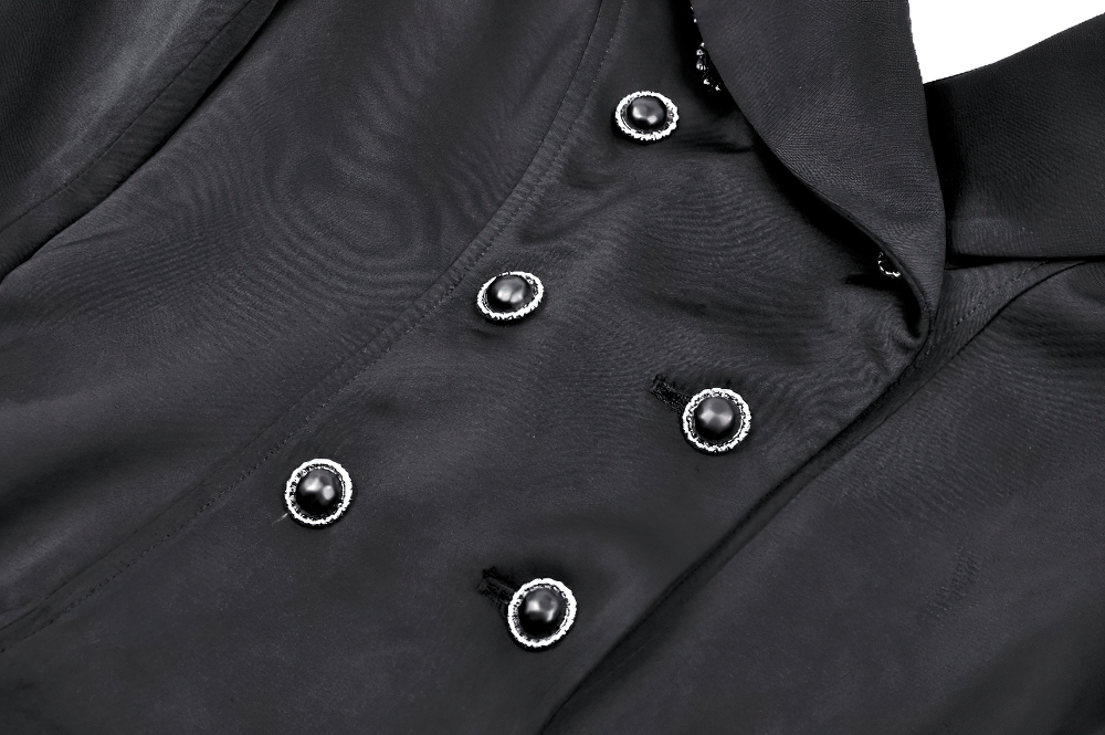 Elegant black Victorian coat detail featuring double-breasted buttons with satin finish for a steampunk style.