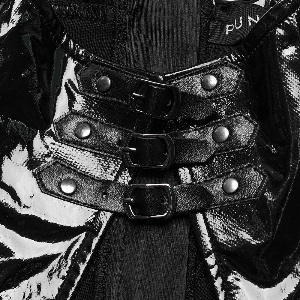 Close-up of black faux leather dress with metal buckles and shiny accents, showcasing edgy punk style.