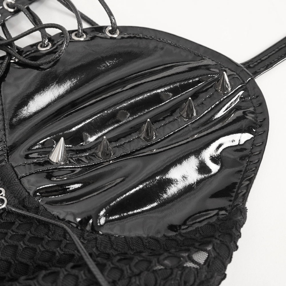 Close-up of the sleek black vinyl bodysuit featuring chic lace-up details and edgy spikes, perfect for daring outfits.