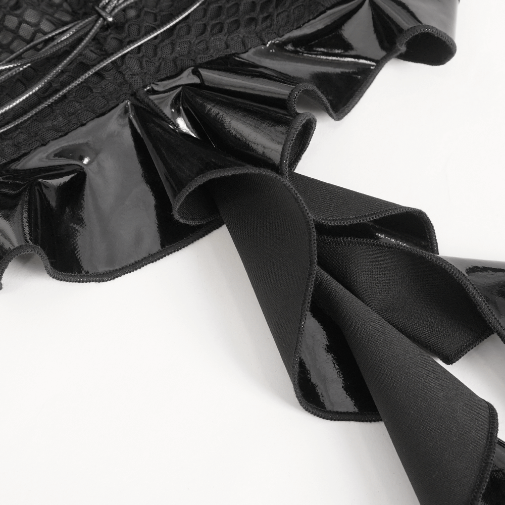 Close-up of the elegant black vinyl bodysuit showcasing ruffled detail and lace-up accents.