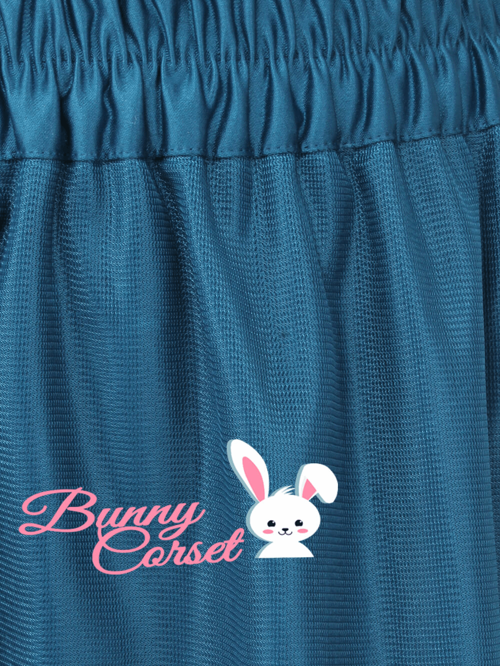 Close-up of a blue mesh fabric with a smocked waistband, featuring Bunny Corset logo.