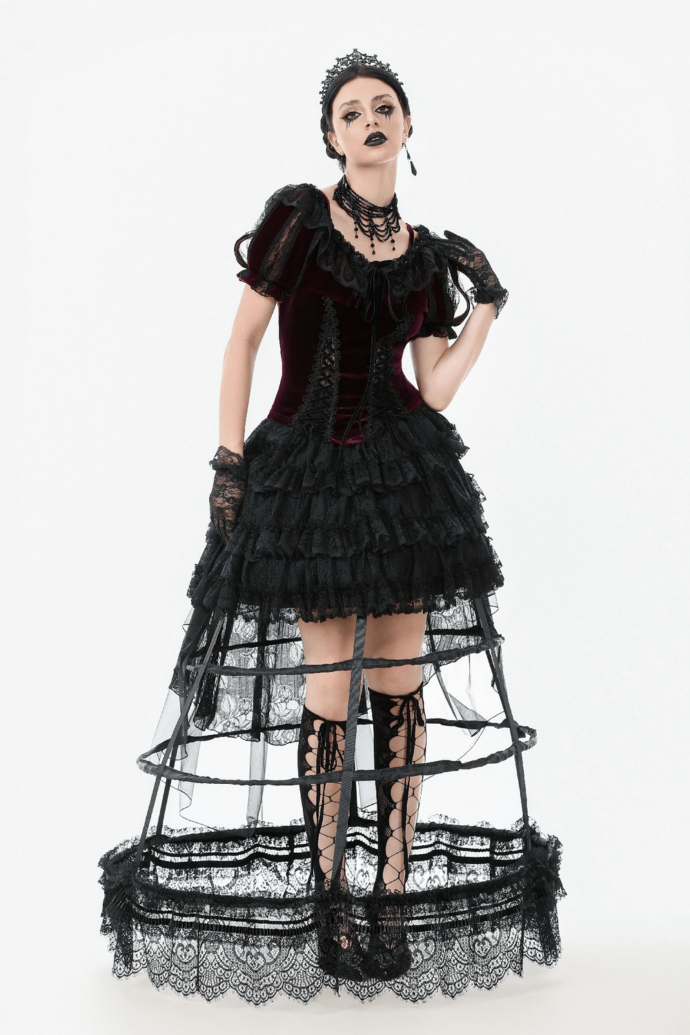 Gothic Victorian outfit featuring a burgundy bolero and black lace layered skirt with corset ties for a dramatic look.
