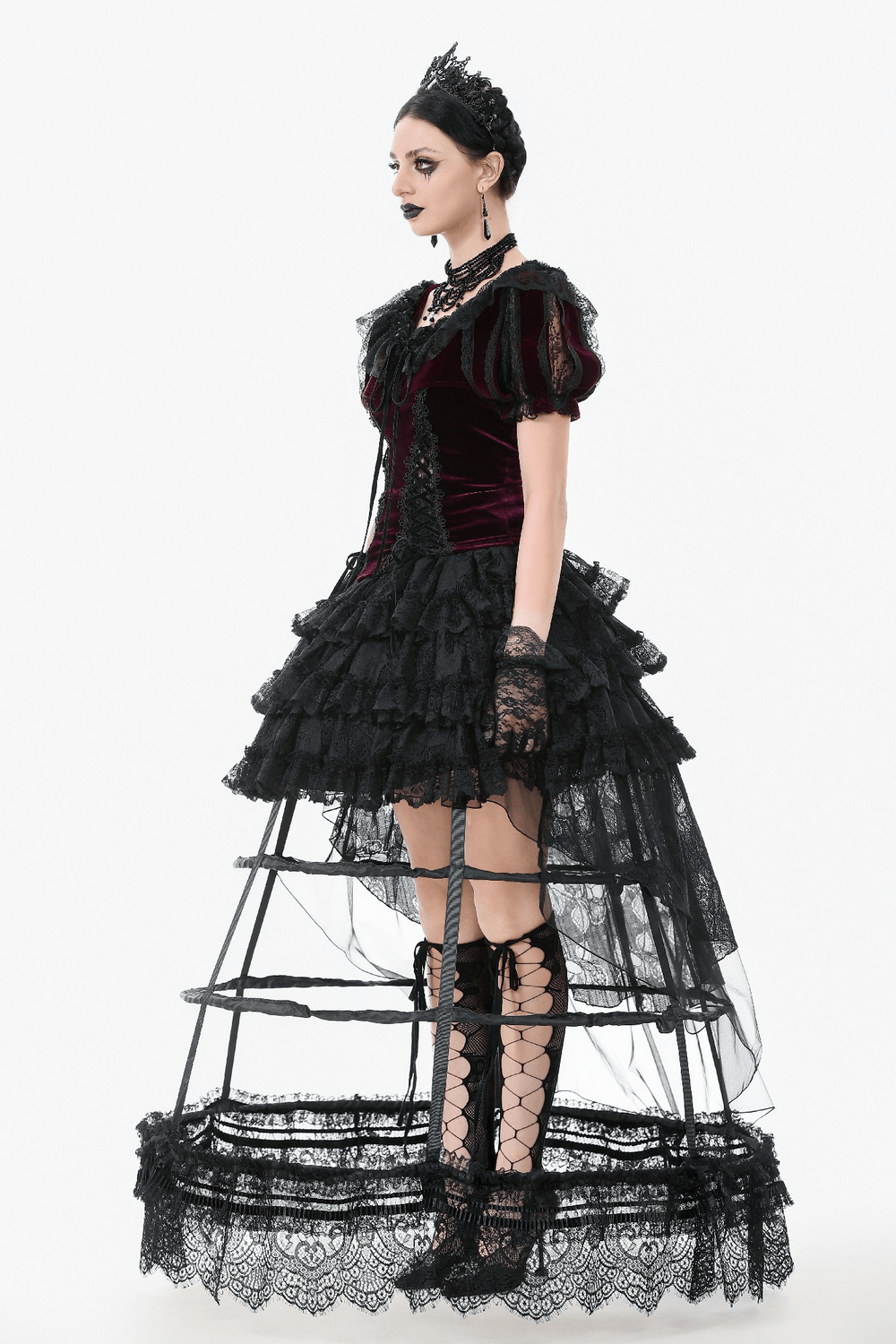 Gothic model in a burgundy Victorian bolero with lace ruffles, showcasing dark romantic fashion.