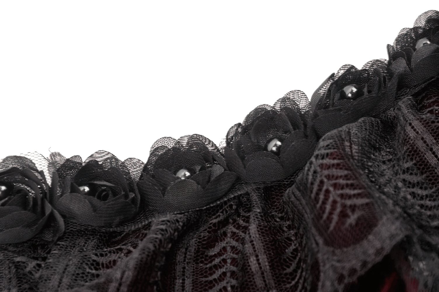 Close-up of black lace and rose applique on a burgundy Victorian bolero, adding gothic elegance.