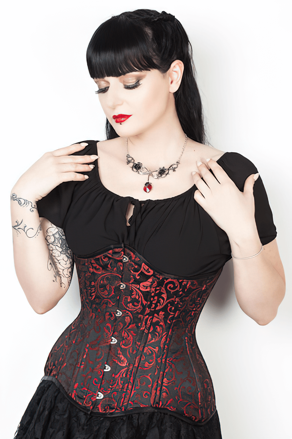 Elegant brocade waist training corset with steel boning, perfect for gothic-inspired style and waist sculpting.