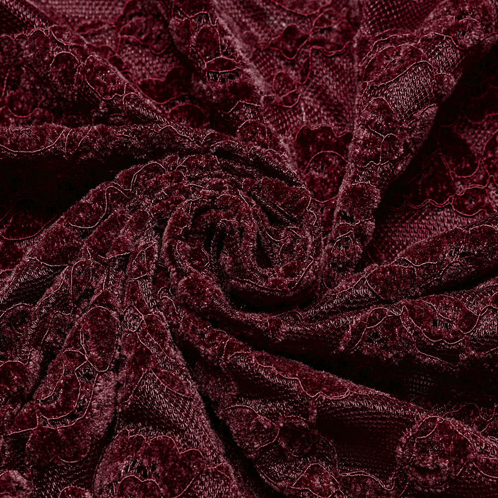 Close-up of elegant burgundy lace fabric showcasing intricate floral patterns and rich texture.