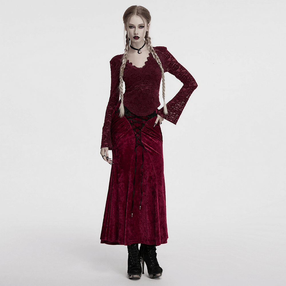 Model in elegant burgundy lace V-neck gothic top with long sleeves and flowing skirt, perfect for dark romantic looks.
