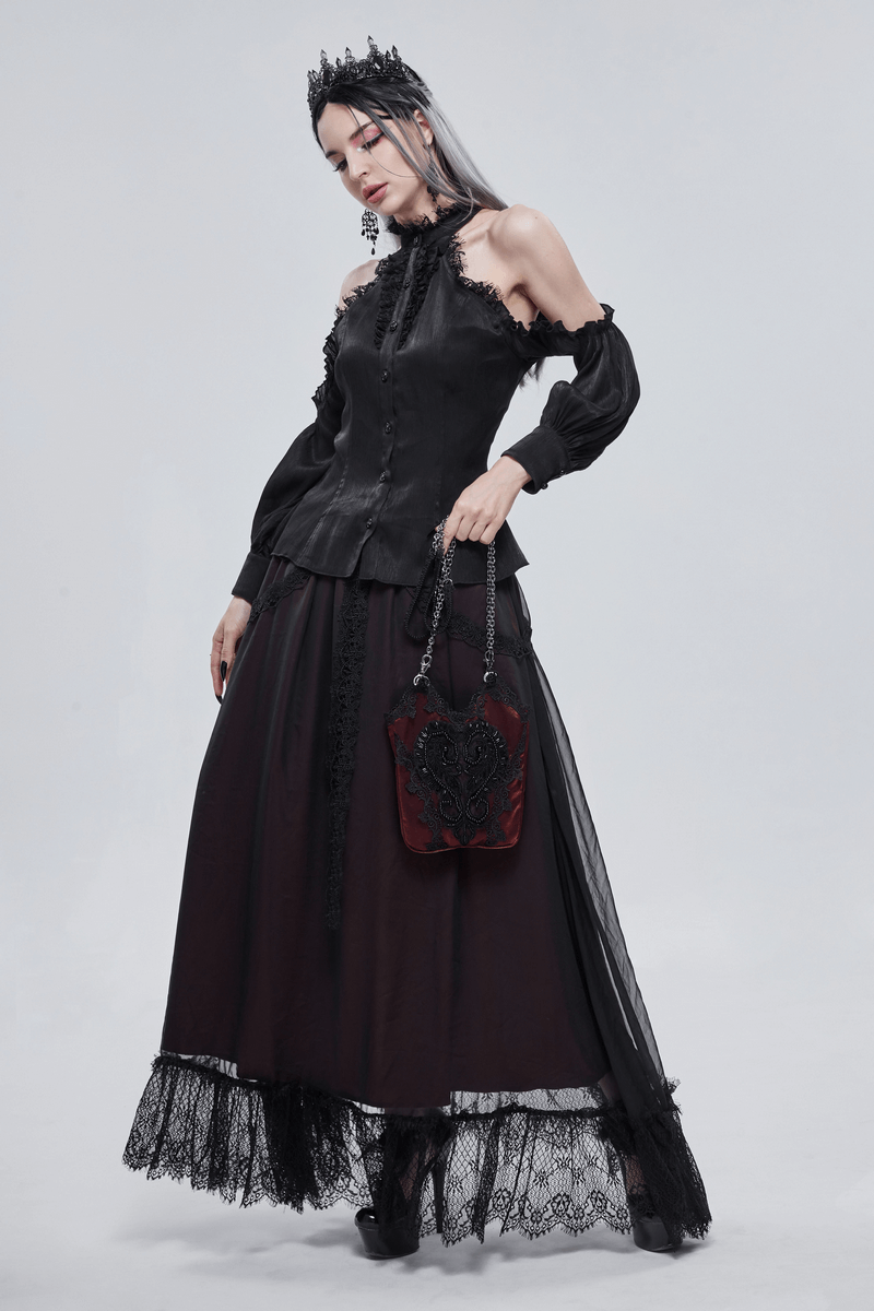Elegant gothic outfit featuring a black blouse, flowy skirt, and a striking red floral bucket bag with guipure details.