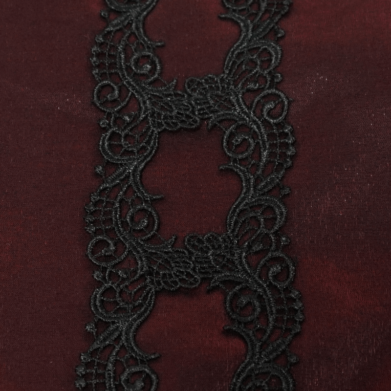 Close-up of elegant black guipure lace on rich red fabric, adding gothic charm to fashion accessories.