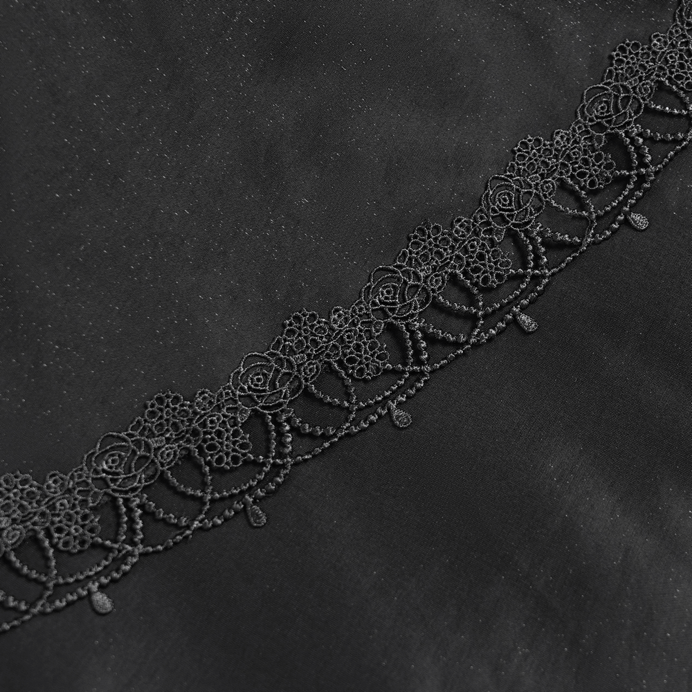 Intricate black lace trim with rose motifs on a flowing dark fabric, perfect for gothic fashion.