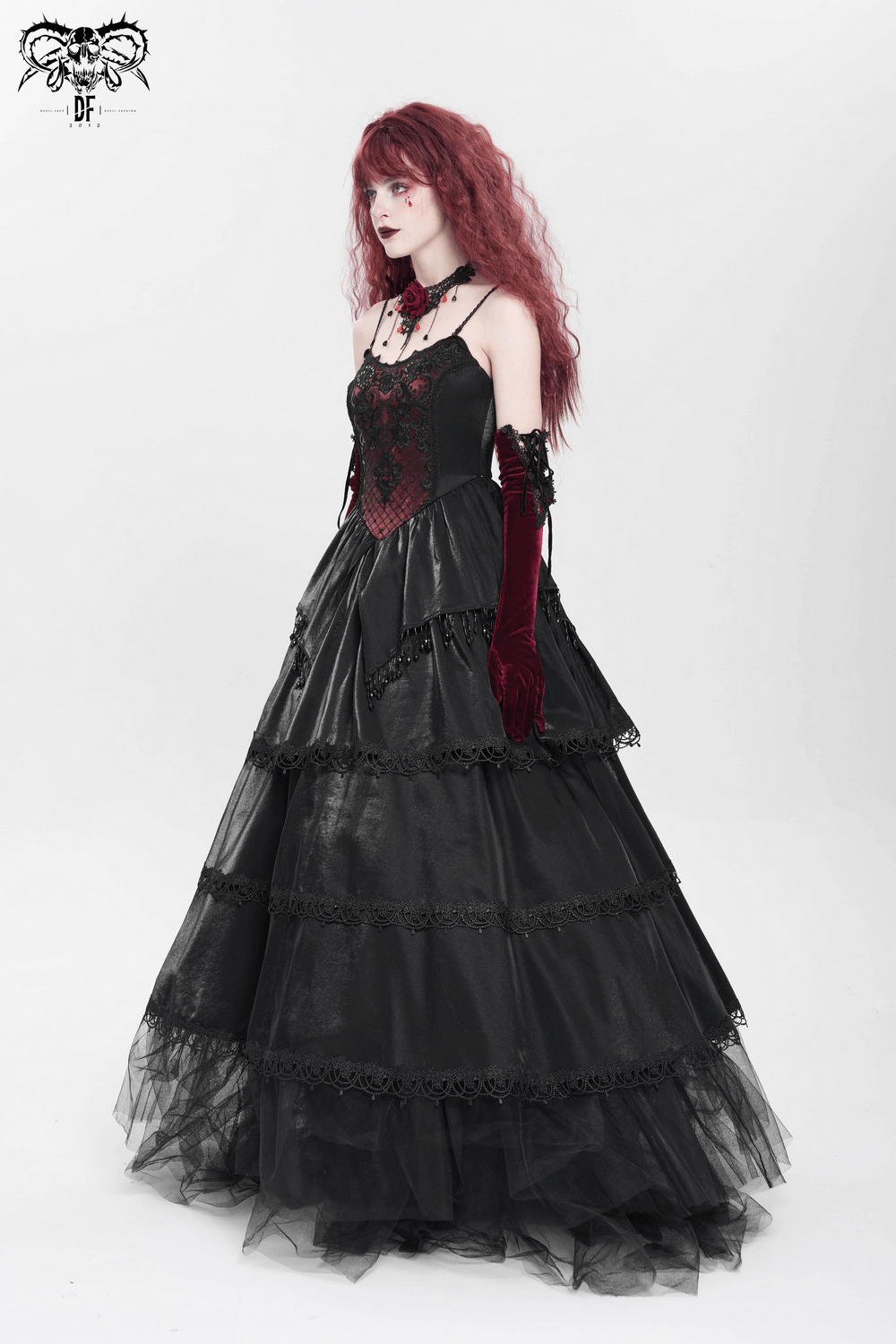 Elegant gothic maxi dress with corset bodice, layered skirt, and lace trim in black satin.