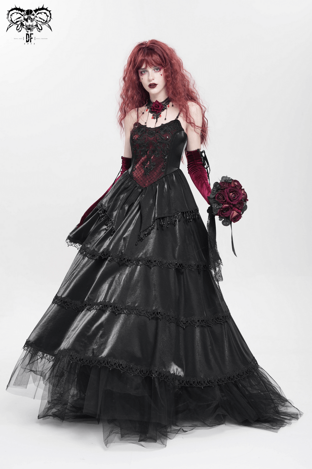 Elegant black corset maxi dress with lace layers and red accents, perfect for gothic fashion lovers.