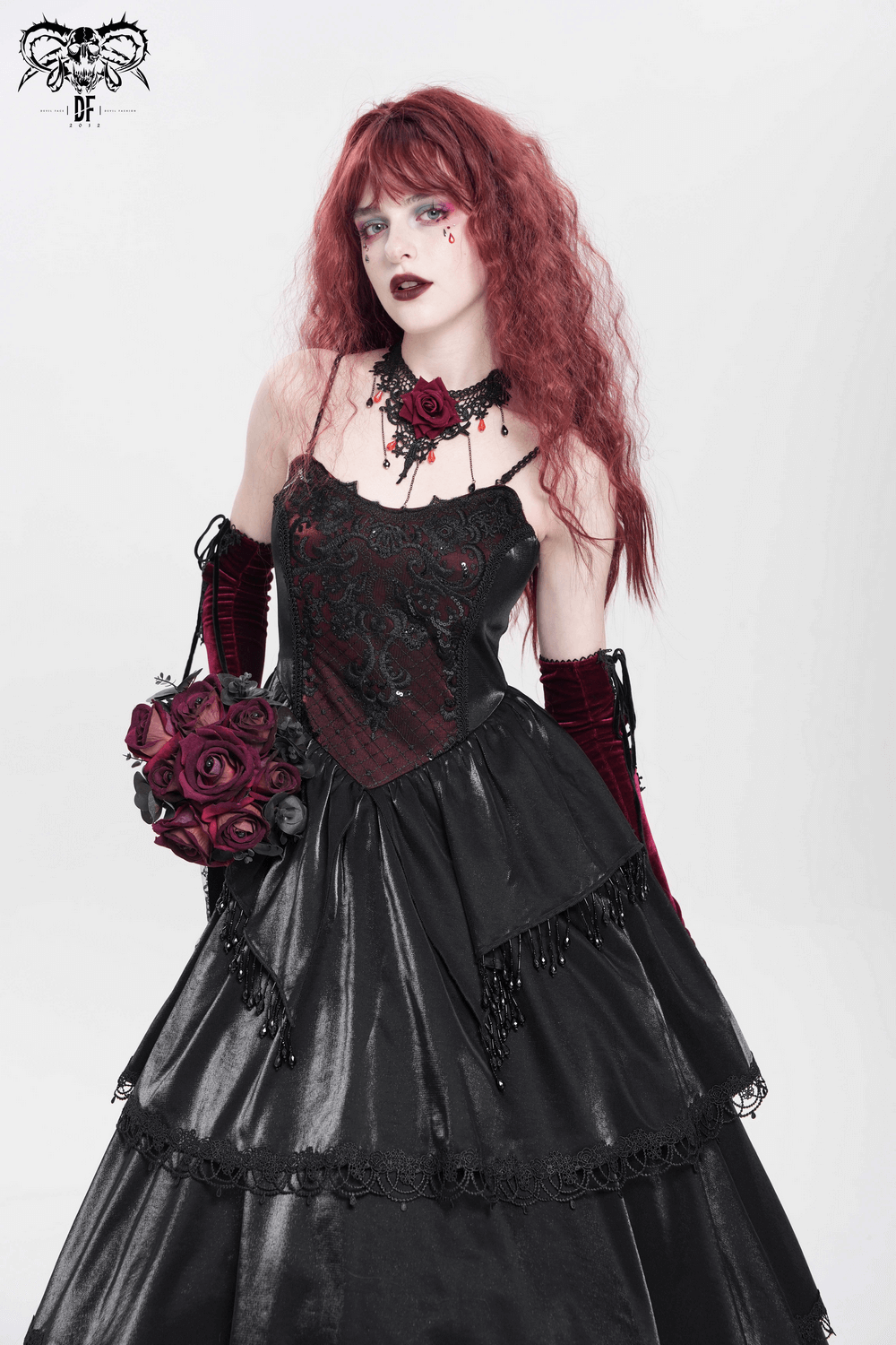 Elegant Victorian corset maxi dress with lace, beads, and a dramatic layered skirt, adorned with roses and gothic accessories.