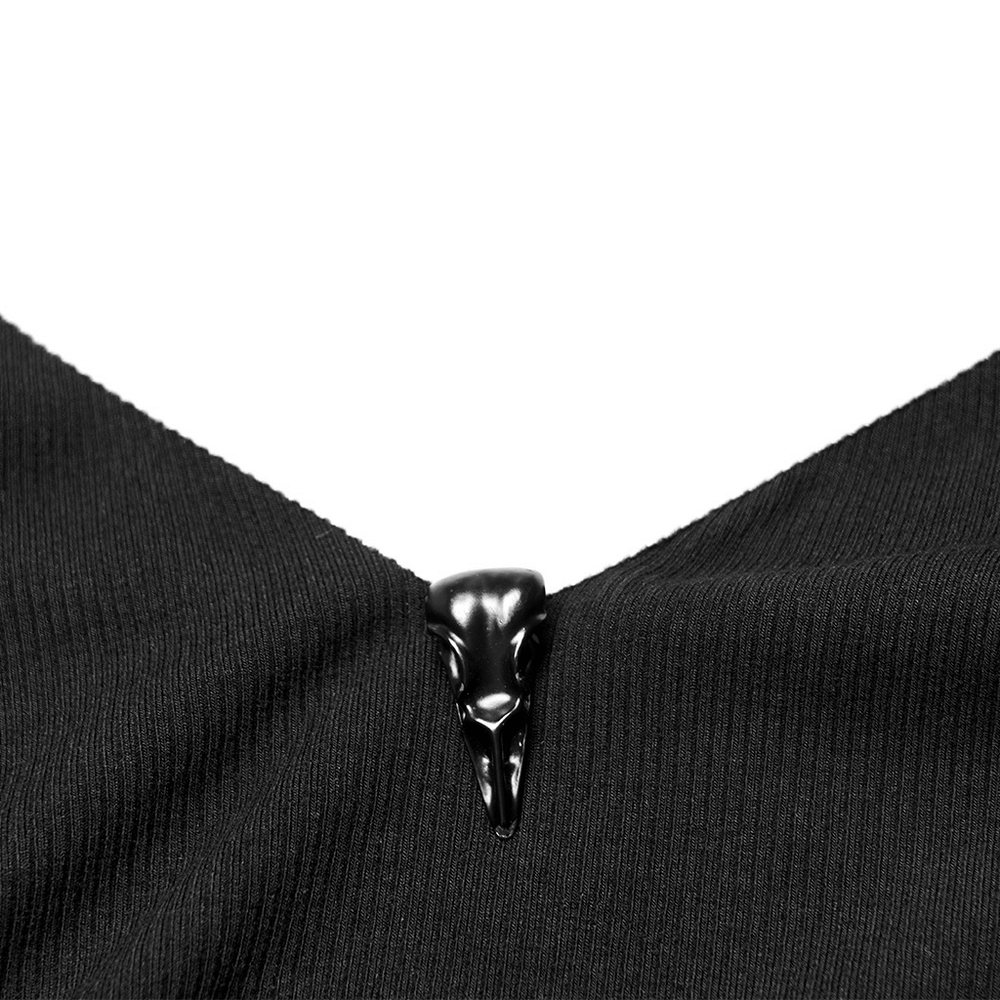 Elegant crow skull decorative buckle on a black camisole, showcasing unique monochrome fashion.